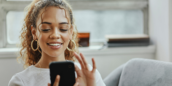 Smiling lady using a mobile device