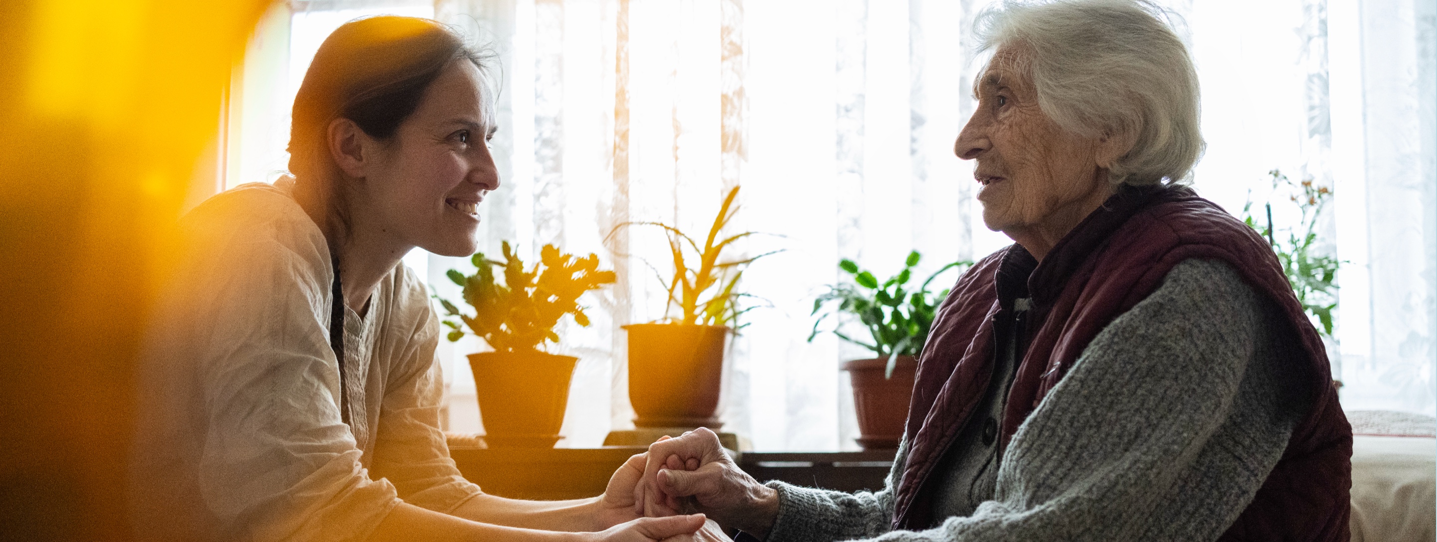 Conversing with an elderly woman.